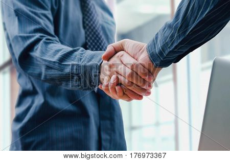 Business people shake hand for partnership and friendship