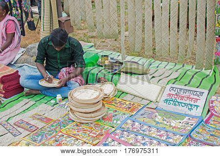 Kolkata West Bengal India - 28th November 2015 : Pattachitra traditional painting on leaves of date-palm handicrafts on display during the Handicraft Fair in Kolkata. It is the biggest handicrafts fair in Asia.