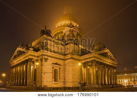 St. Isaac's Cathedral in a mystical fog on the March night. Saint-Petersburg. Russia