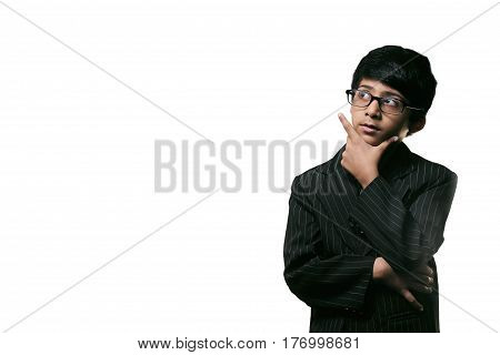Cute Intelligent Little Boy Looking Up Thinking and Wearing Glasses isolated on white background