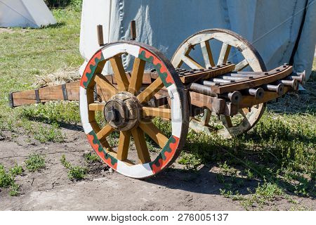 Multi-barrel Gun Old Vintage Reconstruction On Grass Background