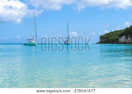 2 Yachts Moored In Marie Galante Turquoise Sea, Guadeloupe Luxury Tourism