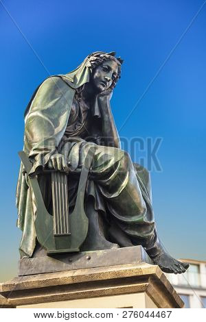 Statue Of Johannes Gutenberg At Gutenberg Fountain From 1840  In Frankfurt With The Allegory Of Poet