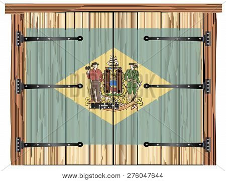 A Large Closed Wooden Barn Double Door With Bolt And Hinges And The Delaware Flag Painted On