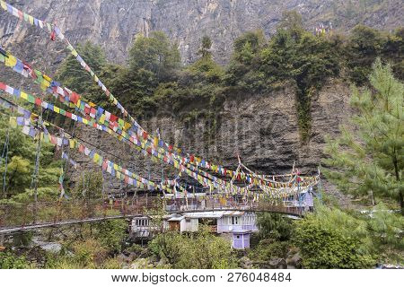 Hanging Bridge To Village Of Chame At The Annapurna Circuit, Nepal