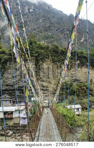 Hanging Bridge To Village Of Chame At The Annapurna Circuit, Nepal