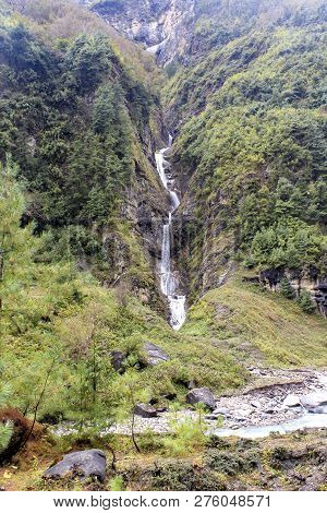 Chame Waterfall At Annapurna Circuit With Green Mountains