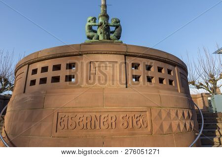 Entrance To Iron Pedestrian Bridge Called Eiserner Steg In Frankfurt With Bronze Figures