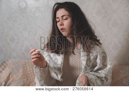 The Girl Puts A Pill On Her Tongue And Prepares To Drink Water.