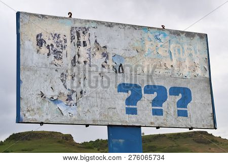 Three Question Marks On A Big Board By The Road
