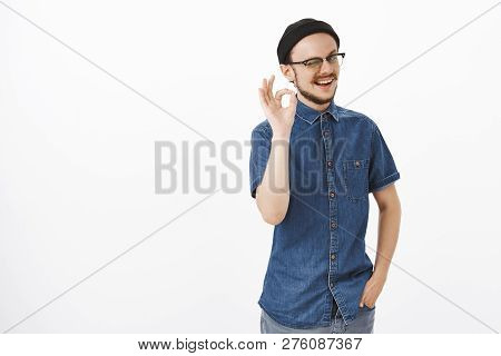 I Got Your Back Covered Okay. Stylish And Friendly Supportive Male Model With Beard Winking And Smil