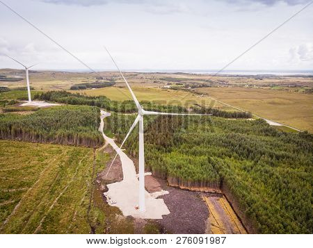 An Aerial View Of Wind Turbines In A Rural Area Between The Towns Of Spiddal And Moycullen In County