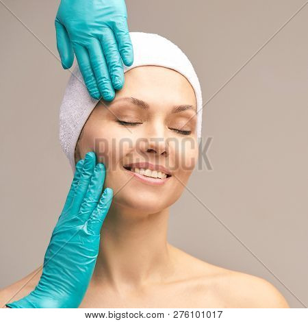 Derma Rejuvenate Treatment. Cosmetology Face Surgery. Anti Wrinkle Exam. Woman And Doctor Glove Hand