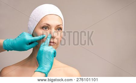 Derma Rejuvenate Treatment. Cosmetology Face Surgery. Anti Wrinkle Exam. Woman And Doctor Glove Hand