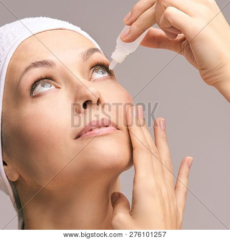 Woman Using Eye Drops. Medicine Treatment. Eyecare Human Problem. Ophtalmology Dropper