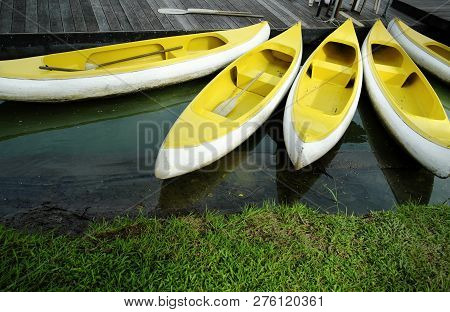 Group Of Rowboat At River And Background