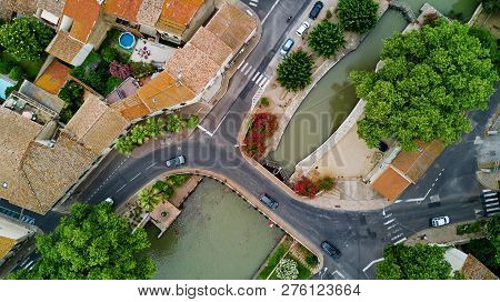 Aerial Top View Of Boats And Lock In Canal Du Midi, Road And Bridge From Above, Southern France
