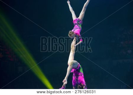 Moscow, Russia - November 16-17, 2018: Acrobats Daria Tikhomirova, Inna Yumashev And Sophia Polishch