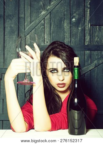 Sensual Elegant Attractive Young Woman With Long Lush Brunette Hair In Stylish Jacket With Wine Bott