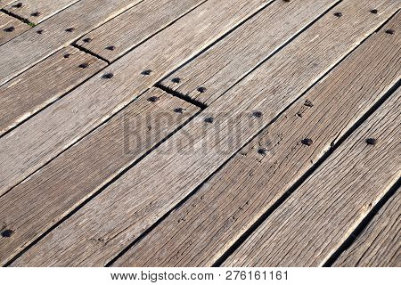 Surface From Old Vintage Wooden Boadrs Fixed By Metal Nails Diagonal View Cloe Up
