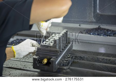 The Cnc Operator Remove The Prepare Work Pieces For Milling Process.the Operation Cnc Milling Machin
