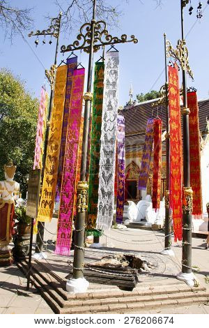 Thai People And Foreign Travelers Hanging Holy Flags Or Colorful Tung Flag Of Lanna Or Northern Of T