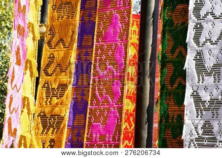 Thai People And Foreign Travelers Hanging Holy Flags Or Colorful Tung Flag Of Lanna Or Northern Of T
