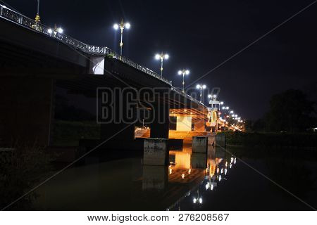 Phaya Mengrai Bridge Road On Thanon Klang Wiang Street Crossover Kok River In Night Time At Chiangra