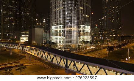 Footbridge With Passersby Above The Road On Night City Background. Stock. Pedestrian Bridge With Peo