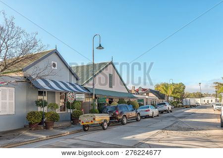 Clanwilliam, South Africa, August 28, 2018: A Street Scene, With Businesses, Vehicles And People, In