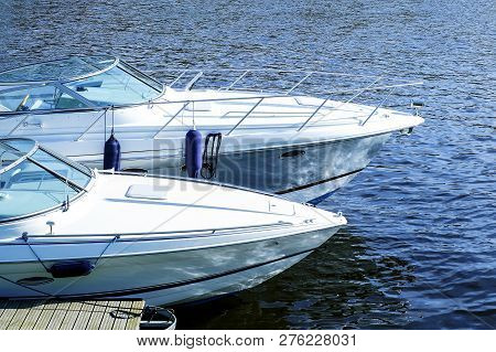 Modern Motor Boats On The Water. Moored On The Water At The Pier.