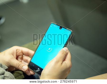 San Francisco, Ca October 6, 2018: Woman Opening Robinhood Mobile App With Logo On Android Screen Wh