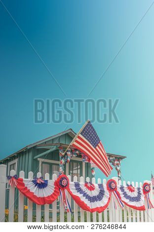 White Picket Fence Usa Home With Flag And Blue Sky And Copy Space