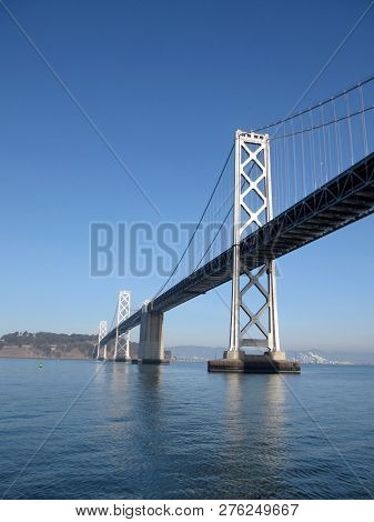 San Francisco Side Of Bay Bridge With Oakland In The Distance On A Clear Day.