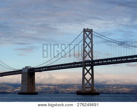 San Francisco Side Of Bay Bridge With Oakland In The Distance On A Clear Day.