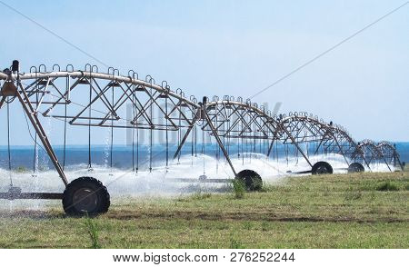 Pivot Irrigation System At Farmland In The Arabian Desert.