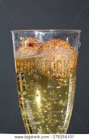 Champagne. Pouring Champagne into a glass. Glass of Champagne.
