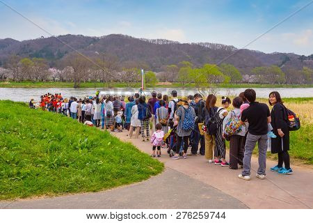 Iwate , Japan - April 22 2018: Unidentified People Wait For Ferry Boat Crossing The Kitakami River T