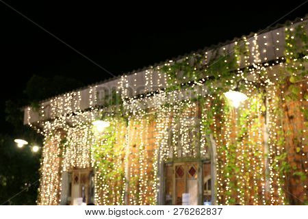 Abstract Bokeh Light Lamp On Spacing Wall Night Time For Blurred Background Decoration Restaurant Or