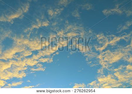 Global Warming, Twilight Sky Evening Time, Sunshine Yellow Gold On Cloud Blue Sky Background