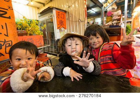 Taiwan, Cingjing - May 2013 : An Unidentified Taiwanese Indigenous Siblings Pose In Front My The Cam