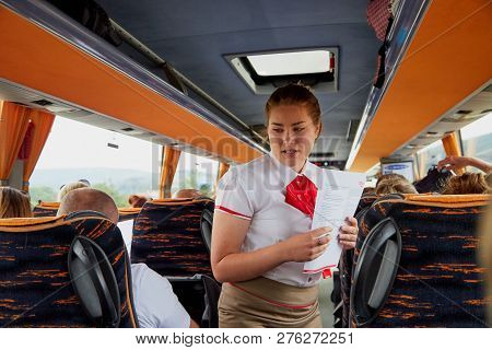 Marmaris, Turkey - May 26, 2018: Female Guide In The Bus With Tourists. People During Travel. Transf