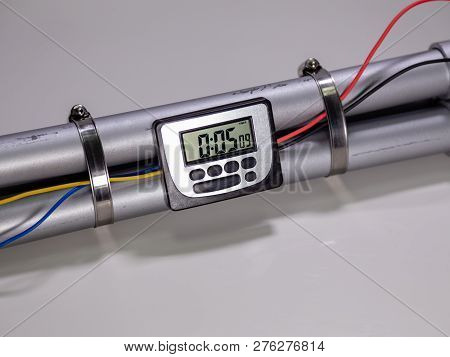 Pipe Bomb With An Clock Timer To Trigger Detonation On White Background