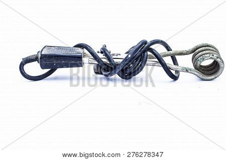 Close Up Of Black Handled Immersion Rod Or Immersion Water Heater Isolated On White.