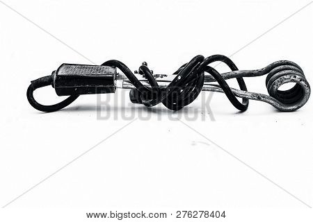 Close Up Of Black Handled Immersion Rod Or Immersion Water Heater Isolated On White.