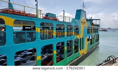 Penang - Malaysia / September 2016: Passengers And Their Cars Using Public Ferry To Move Between Pen