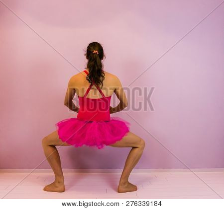 Ballerina Performing A Plie In A Pink Tutu, Classical Ballet Move, Young Transgender Girl In The Dan