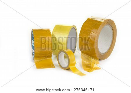 Three Rolls Of Scotch Tape On A White