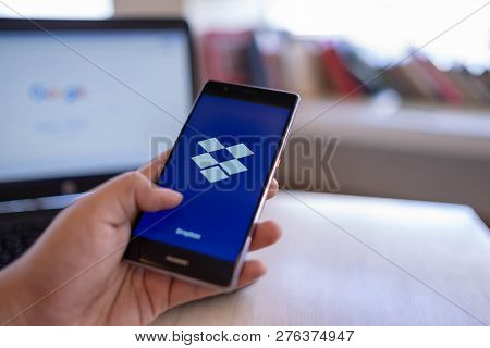 Chiang Mai, Thailand - June 03,2018: Man Holding Huawei With Dropbox On Screen. Dropbox Is A Service