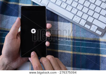 Chiang Mai, Thailand - Mar 28,2018: Man Holding Huawei With Uber Apps. Uber Is Smartphone App Transp